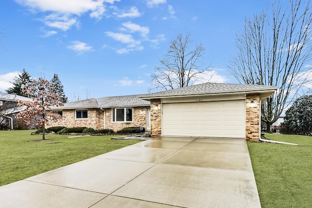 ranch-style home featuring a garage, concrete driveway, a front lawn, and brick siding