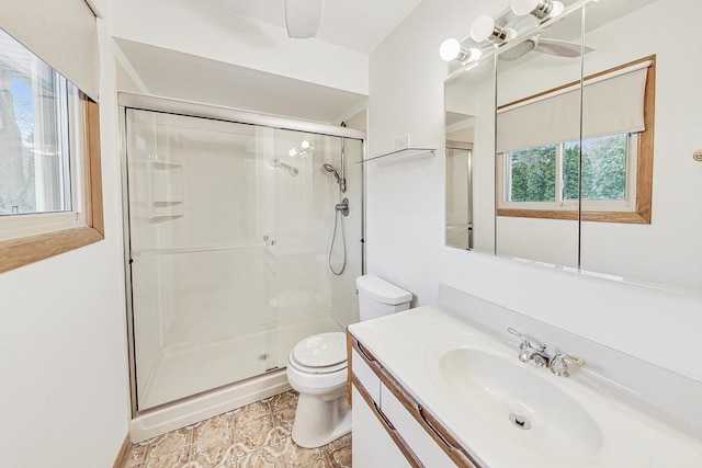 full bathroom with toilet, a shower stall, and vanity