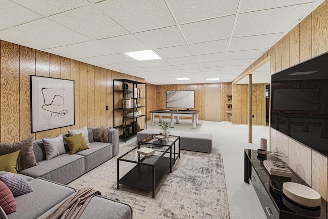 living room featuring carpet floors, wood walls, billiards, and a paneled ceiling