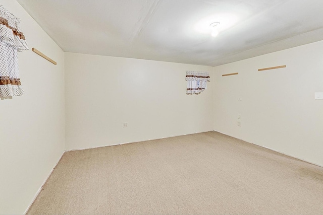 empty room with light colored carpet