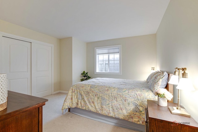 carpeted bedroom featuring a closet