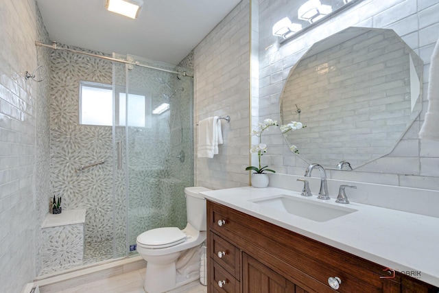 bathroom with toilet, tile walls, walk in shower, and vanity