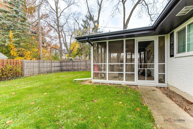 view of yard featuring a sunroom