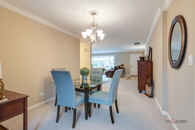 carpeted dining area with a notable chandelier and ornamental molding