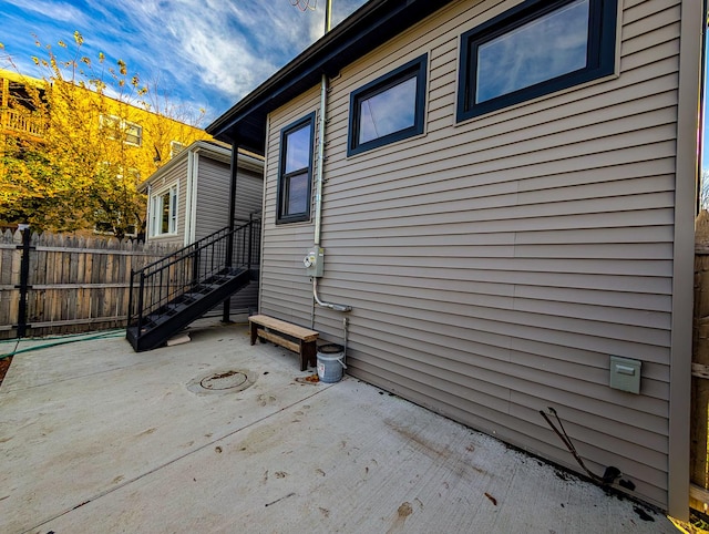 view of side of property featuring a patio area