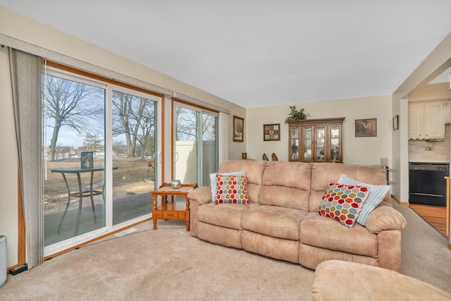 living room featuring visible vents and light colored carpet