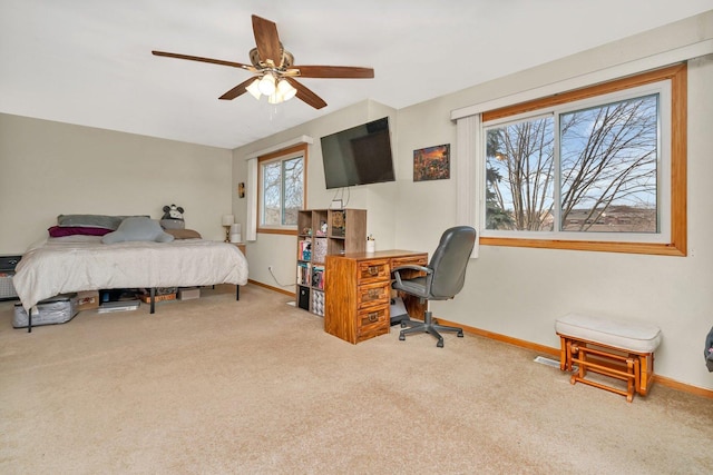 bedroom with carpet floors, ceiling fan, and baseboards