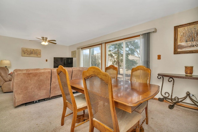 dining room featuring light colored carpet