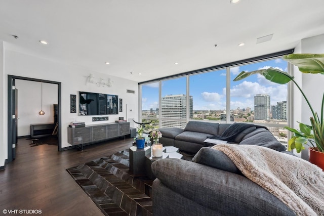 living area featuring a wall of windows, recessed lighting, and dark wood-style flooring