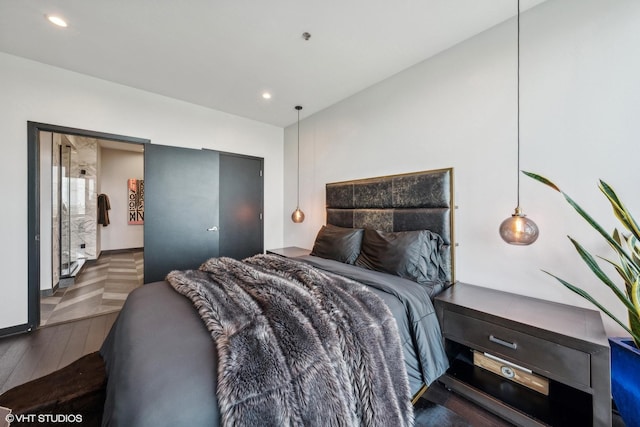 bedroom with dark wood-style floors and recessed lighting