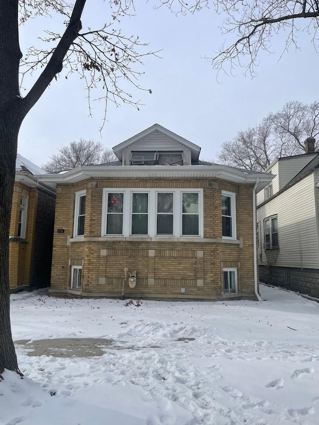 view of snow covered house