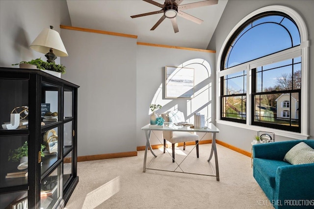 carpeted office with high vaulted ceiling, baseboards, and a ceiling fan