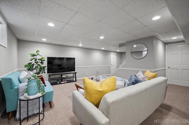 living area with baseboards, carpet flooring, a paneled ceiling, and recessed lighting