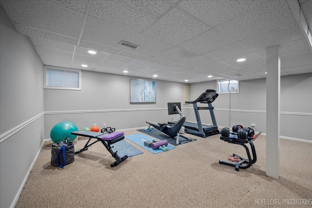 workout area with carpet floors, baseboards, and visible vents