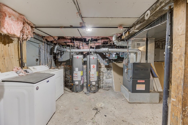 interior space with washing machine and clothes dryer and water heater