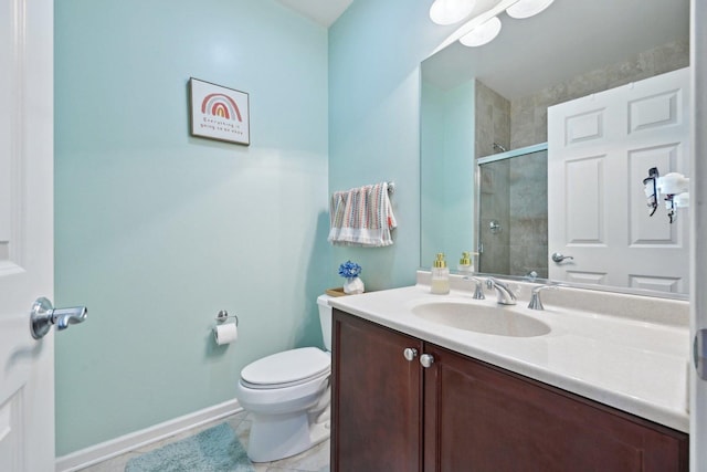 bathroom featuring toilet, vanity, baseboards, tiled shower, and tile patterned floors