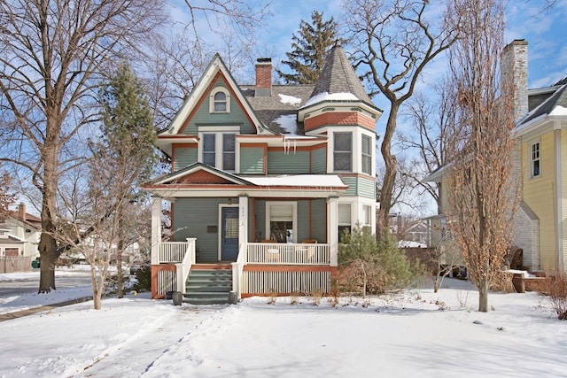 victorian-style house featuring covered porch