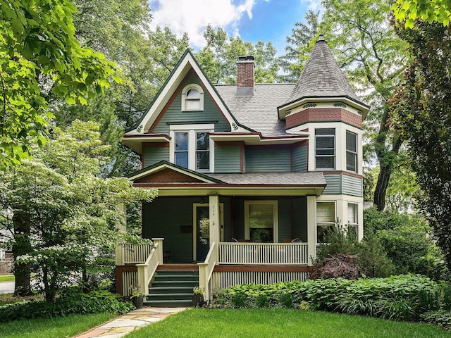 victorian-style house featuring a porch