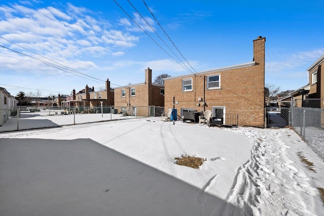 exterior space with a chimney, a residential view, and fence