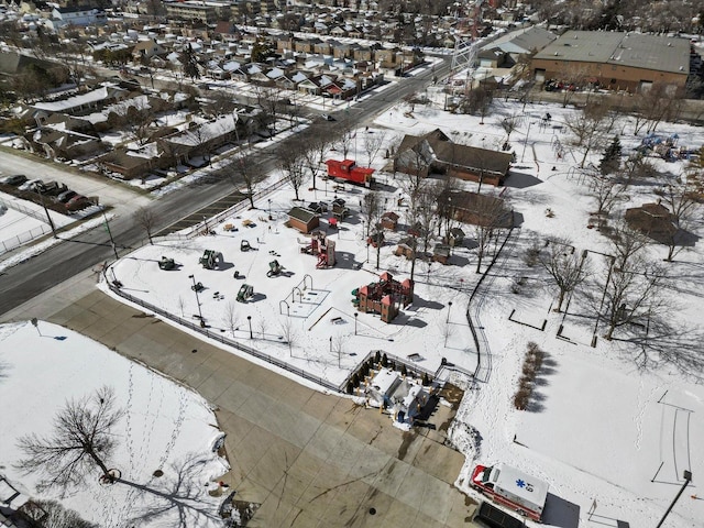 snowy aerial view with a residential view