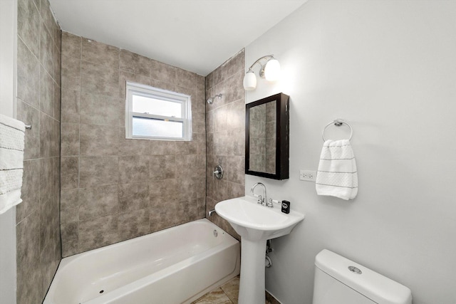 full bathroom with toilet and bathtub / shower combination