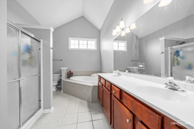 full bathroom with tile patterned flooring, vaulted ceiling, toilet, and a sink