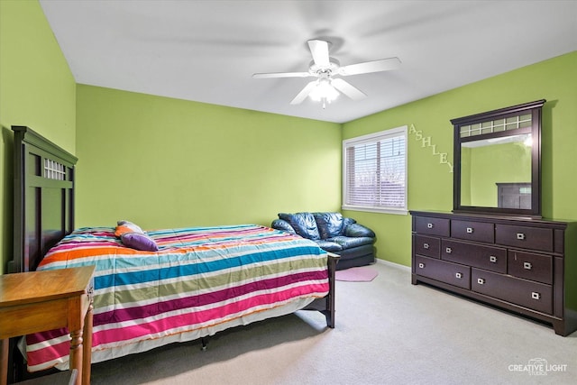 carpeted bedroom with baseboards and a ceiling fan