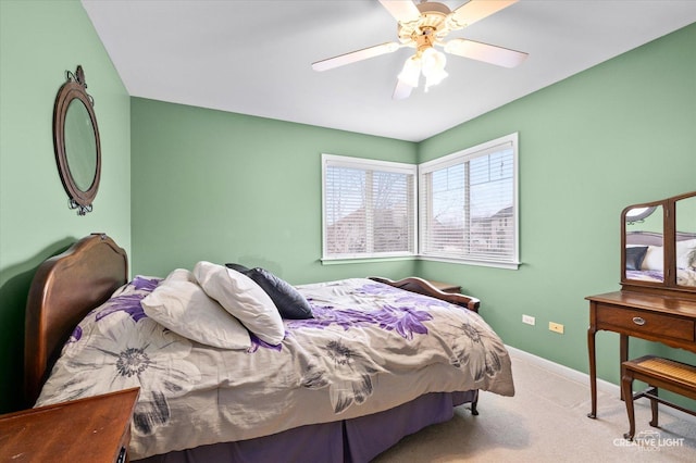 carpeted bedroom featuring a ceiling fan and baseboards