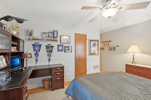 bedroom featuring baseboards, visible vents, and a ceiling fan