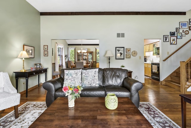 living room featuring stairs, wood finished floors, visible vents, and an inviting chandelier