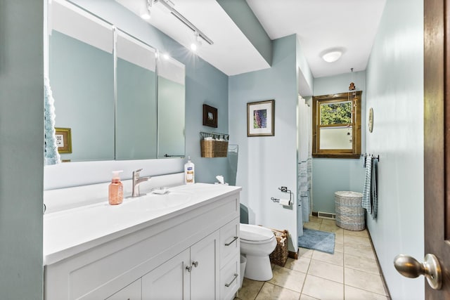 full bathroom with visible vents, toilet, a shower with curtain, tile patterned flooring, and vanity