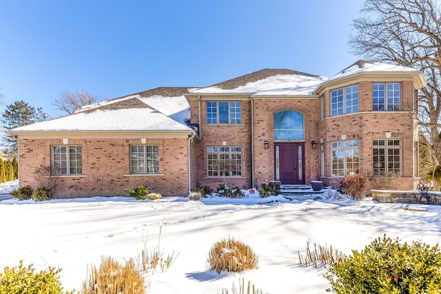 traditional-style home with brick siding