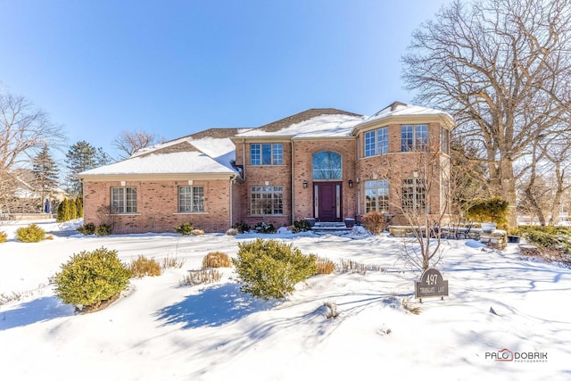 traditional-style home with brick siding