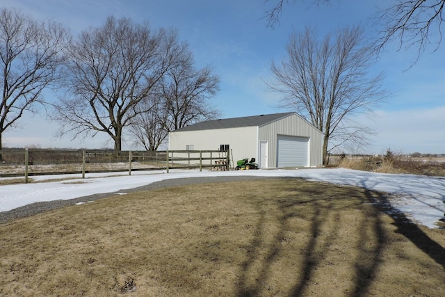 exterior space featuring fence and an outdoor structure