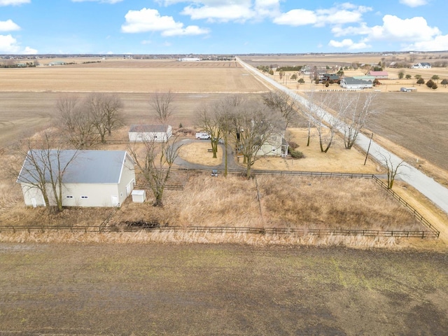 birds eye view of property with a rural view