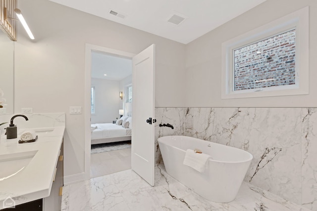 bathroom featuring a tub and vanity