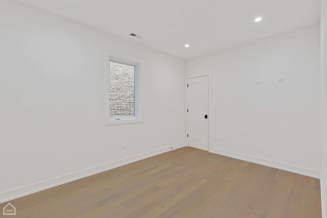 unfurnished room featuring hardwood / wood-style floors