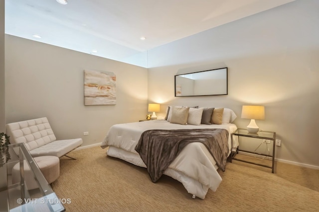 bedroom featuring recessed lighting, light colored carpet, and baseboards