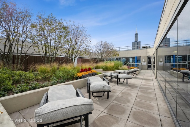 view of patio featuring fence