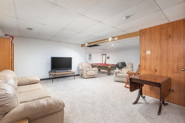 living area featuring carpet flooring, a paneled ceiling, wooden walls, and billiards