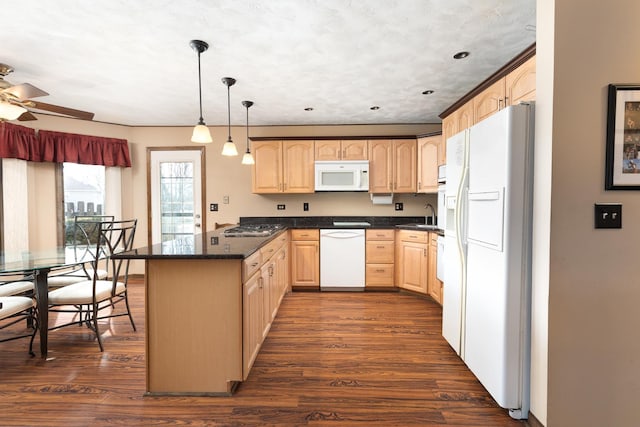 kitchen with white appliances, dark wood-type flooring, a peninsula, and light brown cabinetry