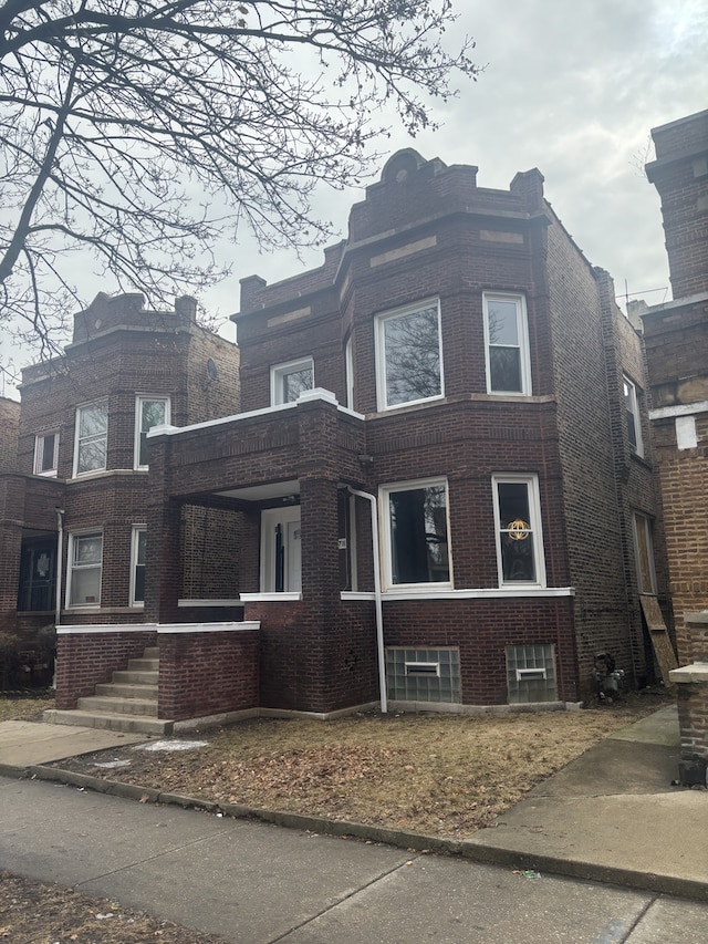 view of front of house featuring brick siding