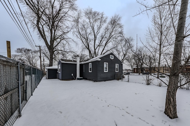 view of snow covered house