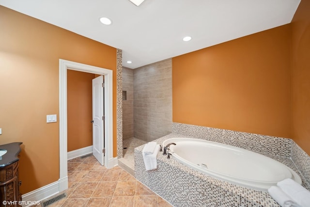 bathroom featuring baseboards, visible vents, a garden tub, vanity, and recessed lighting