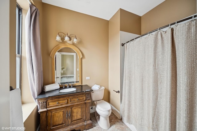 bathroom with toilet, a shower with curtain, tile patterned flooring, and vanity