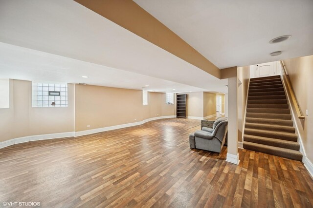 interior space featuring stairway, recessed lighting, wood finished floors, and baseboards