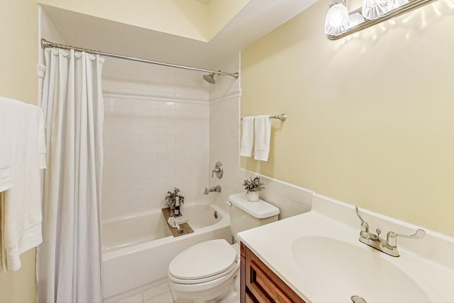 bathroom featuring shower / tub combo, vanity, toilet, and tile patterned floors