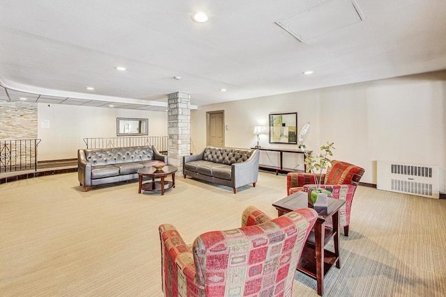 living area with carpet, decorative columns, attic access, and recessed lighting