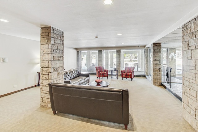 living area featuring recessed lighting, carpet flooring, decorative columns, and baseboards