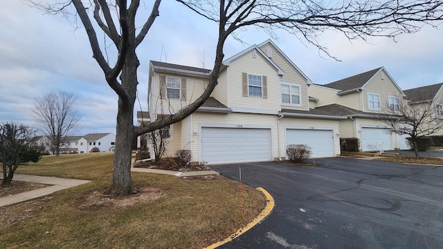 view of front facade with a front lawn and a garage